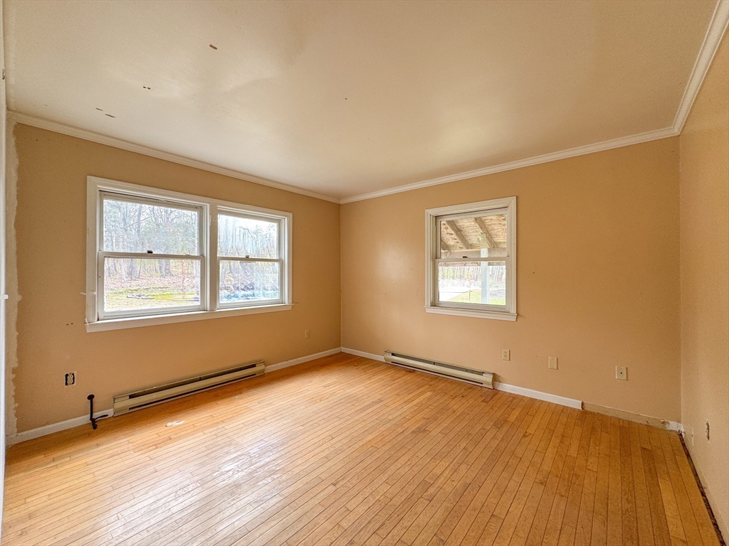 30 Abbey Road, Unit 108 Leominster, MA 01453 - Photo 11 of 21 a view of an empty room with wooden floor and a window
