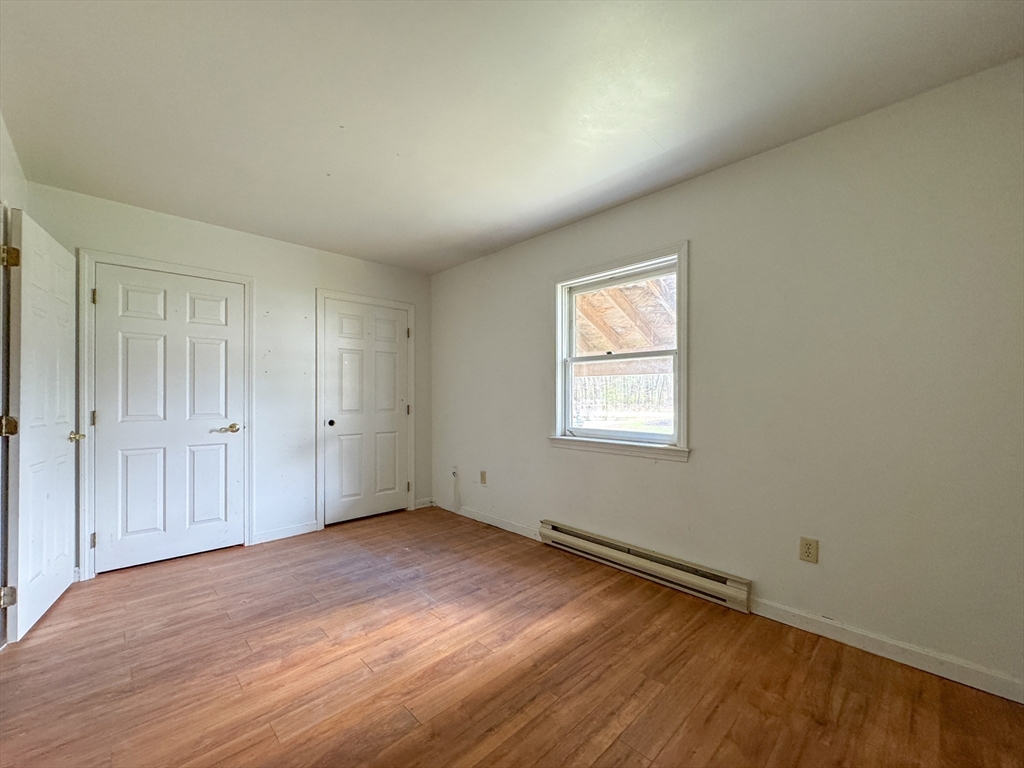 30 Abbey Road, Unit 108 Leominster, MA 01453 - Photo 16 of 21 a view of an empty room with wooden floor and a window