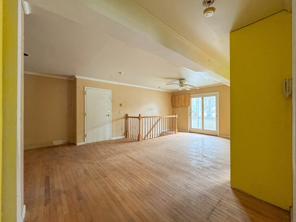 30 Abbey Road, Unit 108 Leominster, MA 01453 - Photo 18 of 21 a view of an empty room with wooden floor and a window