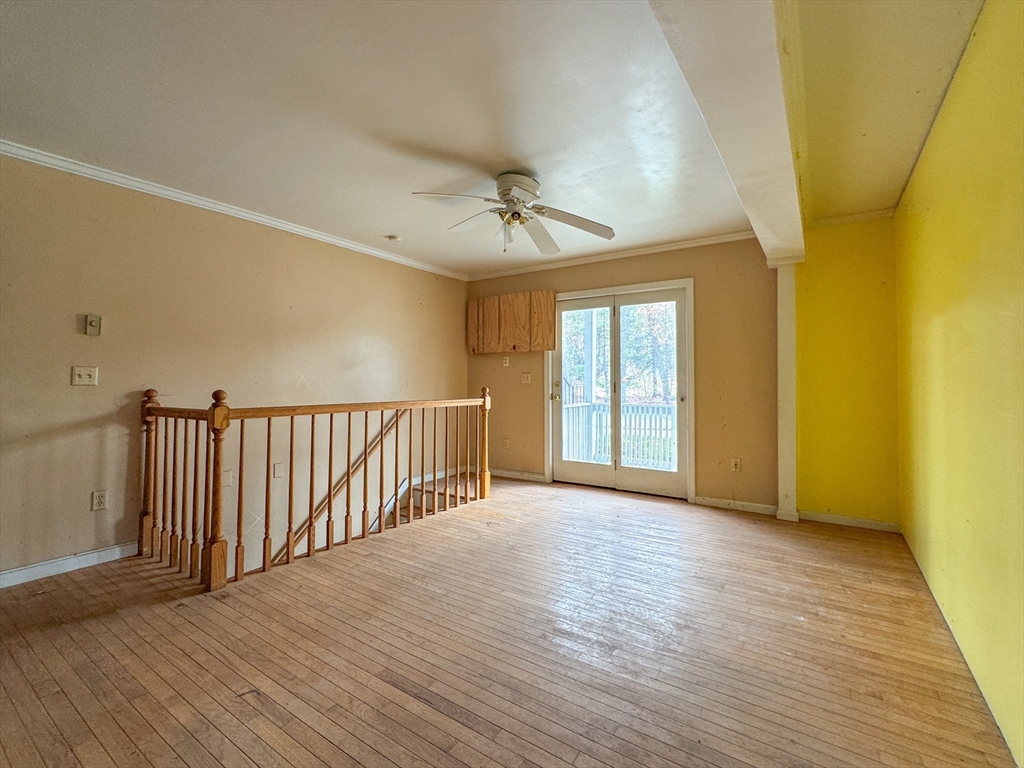 30 Abbey Road, Unit 108 Leominster, MA 01453 - Photo 8 of 21 a view of an empty room with wooden floor and a window