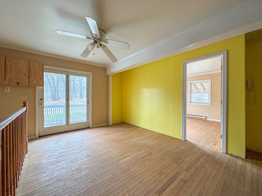 30 Abbey Road, Unit 108 Leominster, MA 01453 - Photo 10 of 21 a view of an empty room with window and wooden floor