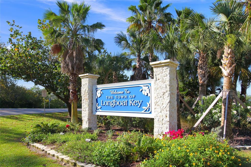 3421 Bayou Sound Longboat Key, FL 34228 - Photo 72 of 79 a sign that is sitting in front of flowers