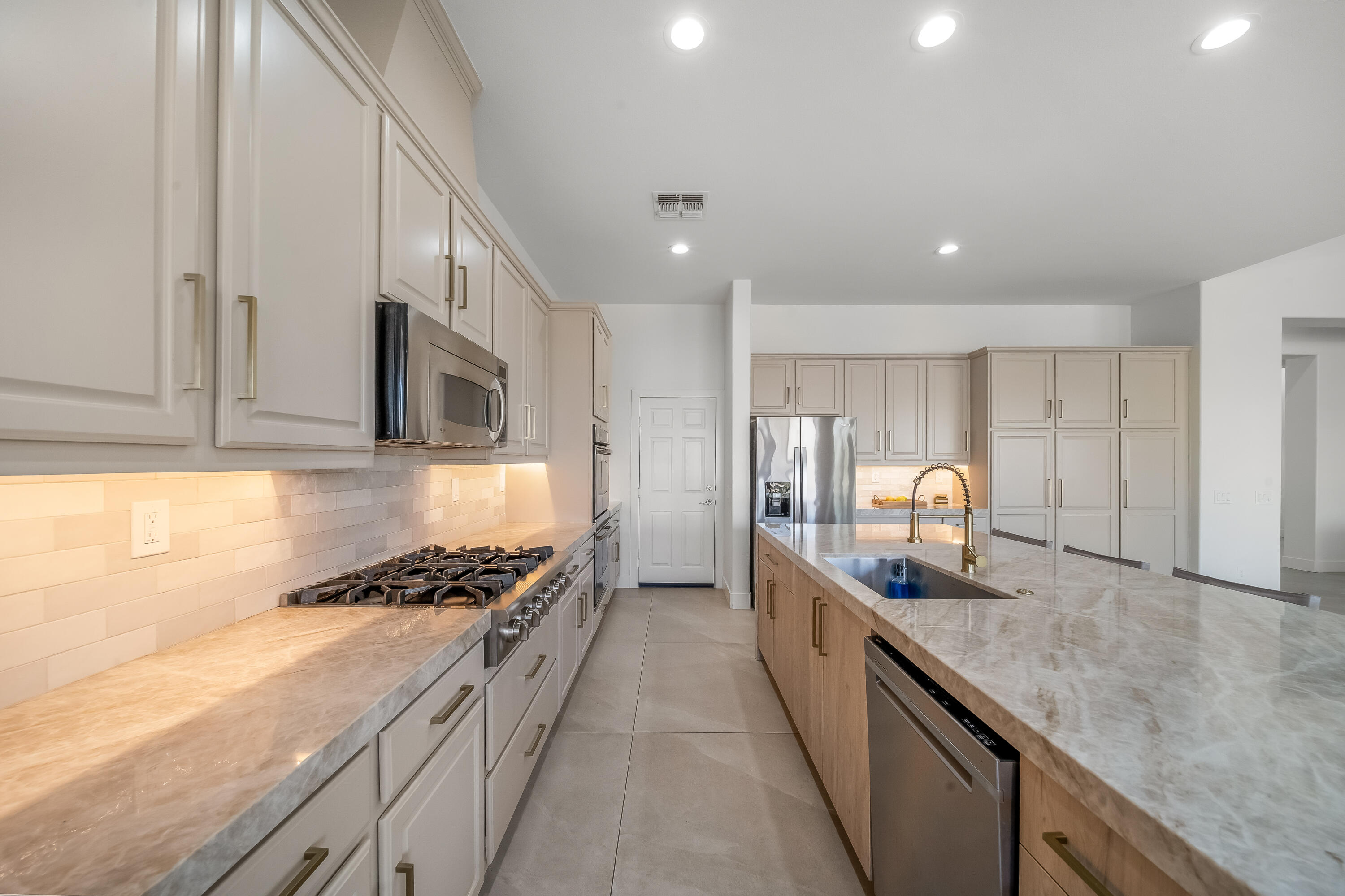 80262 Amazon Avenue Indio, CA 92201 - Photo 20 of 69 a kitchen with counter top space cabinets and stainless steel appliances