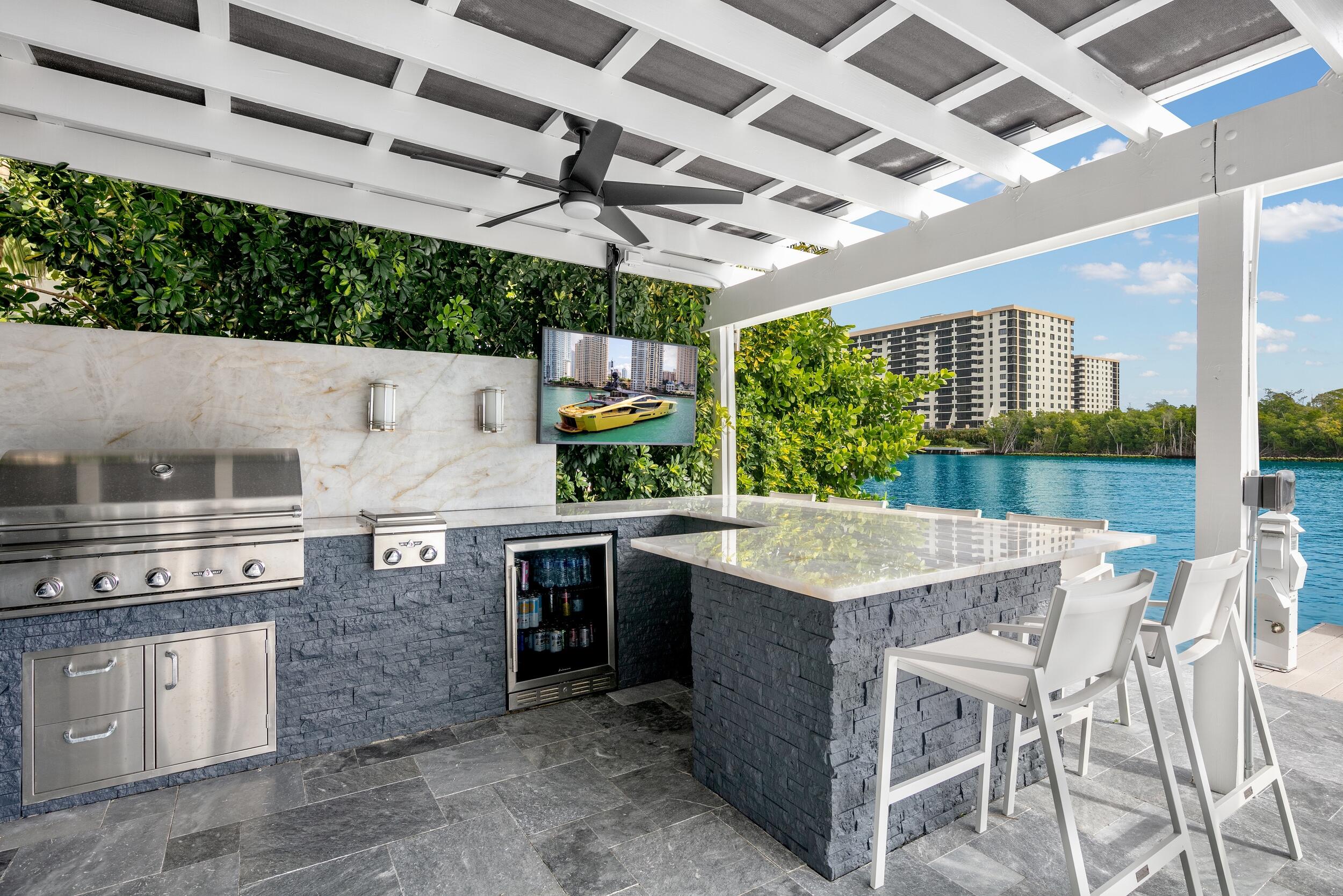 7188 Northeast 8th Drive Boca Raton, FL 33487 - Photo 60 of 65 705-BBQ Area 1 TV