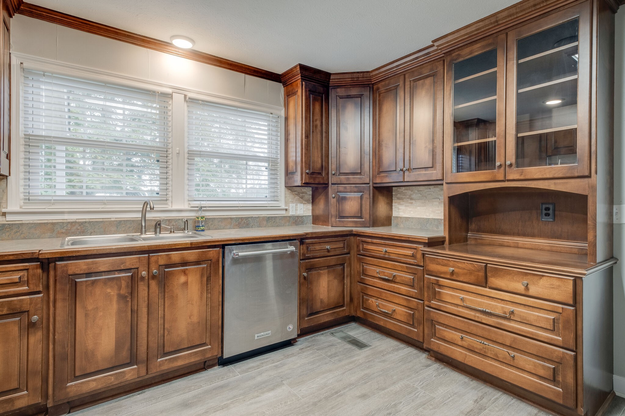 8860 Lyles Road Lyles, TN 37098 - Photo 11 of 36 a kitchen with stainless steel appliances granite countertop cabinets and window