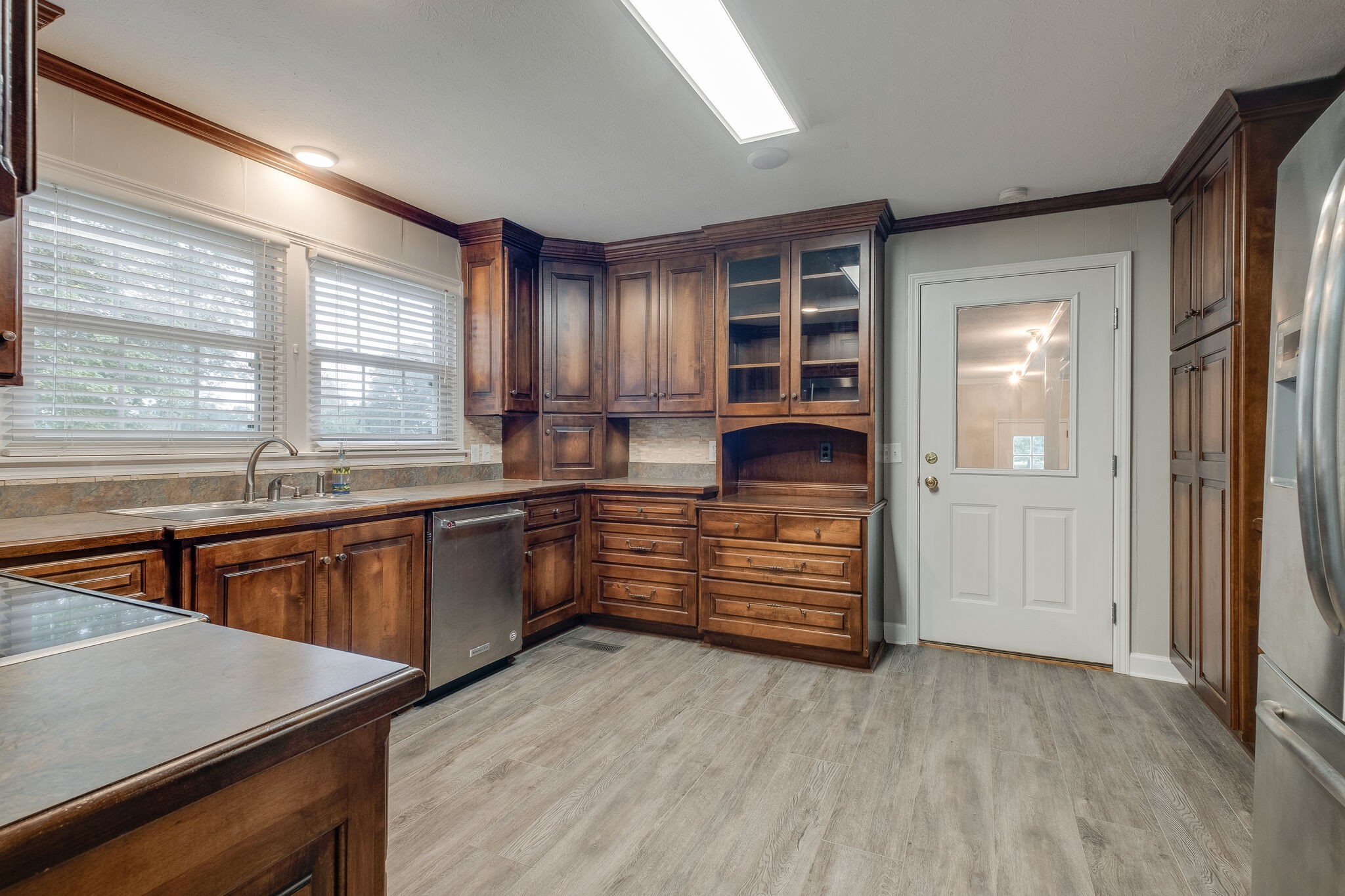 8860 Lyles Road Lyles, TN 37098 - Photo 14 of 36 a kitchen with granite countertop a stove and a sink