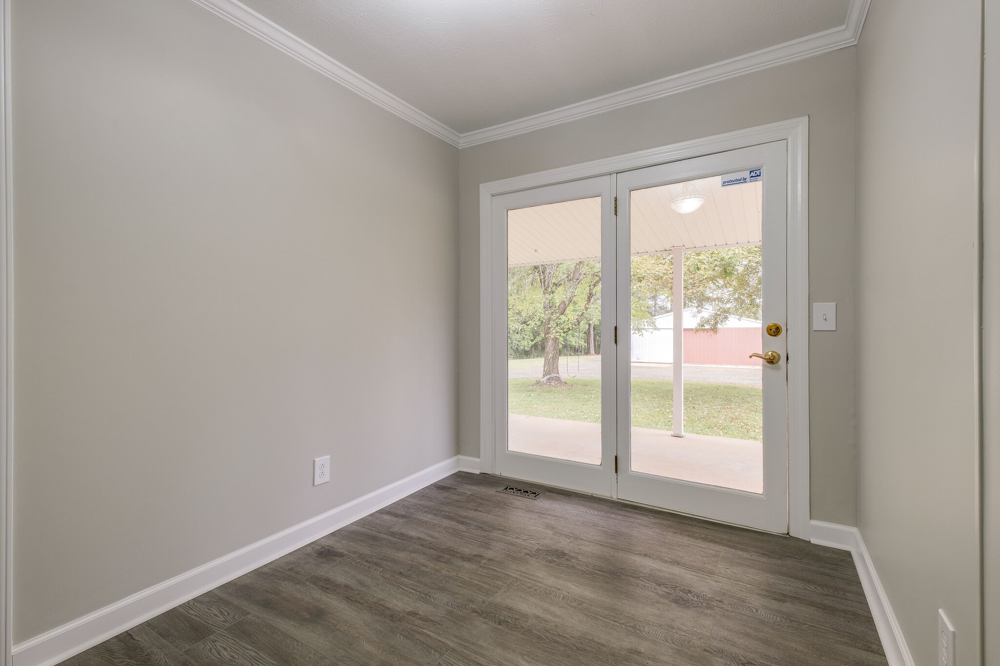 8860 Lyles Road Lyles, TN 37098 - Photo 15 of 36 a view of an empty room and wooden floor and a window