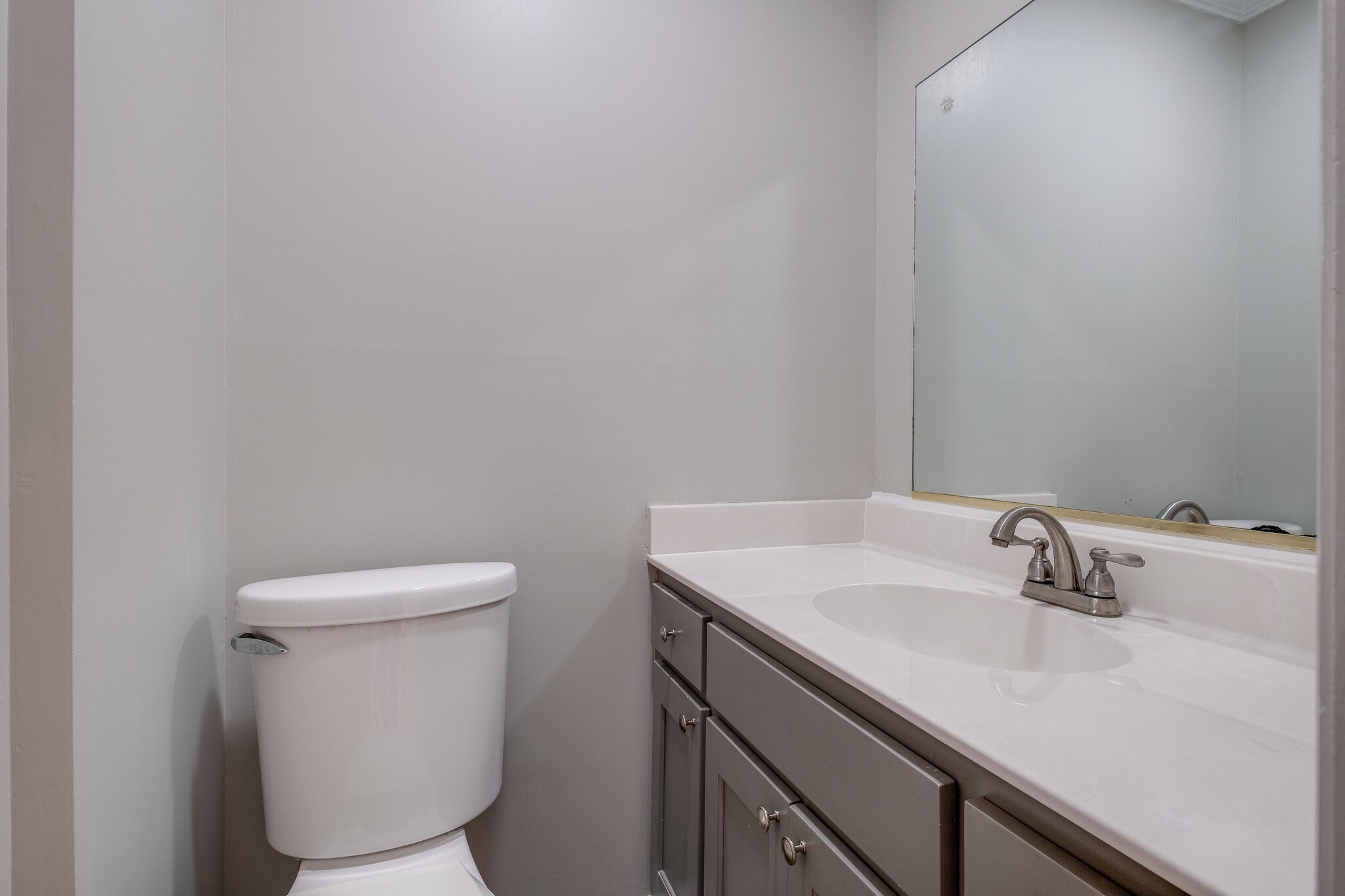 8860 Lyles Road Lyles, TN 37098 - Photo 16 of 36 a bathroom with a sink a toilet and a mirror