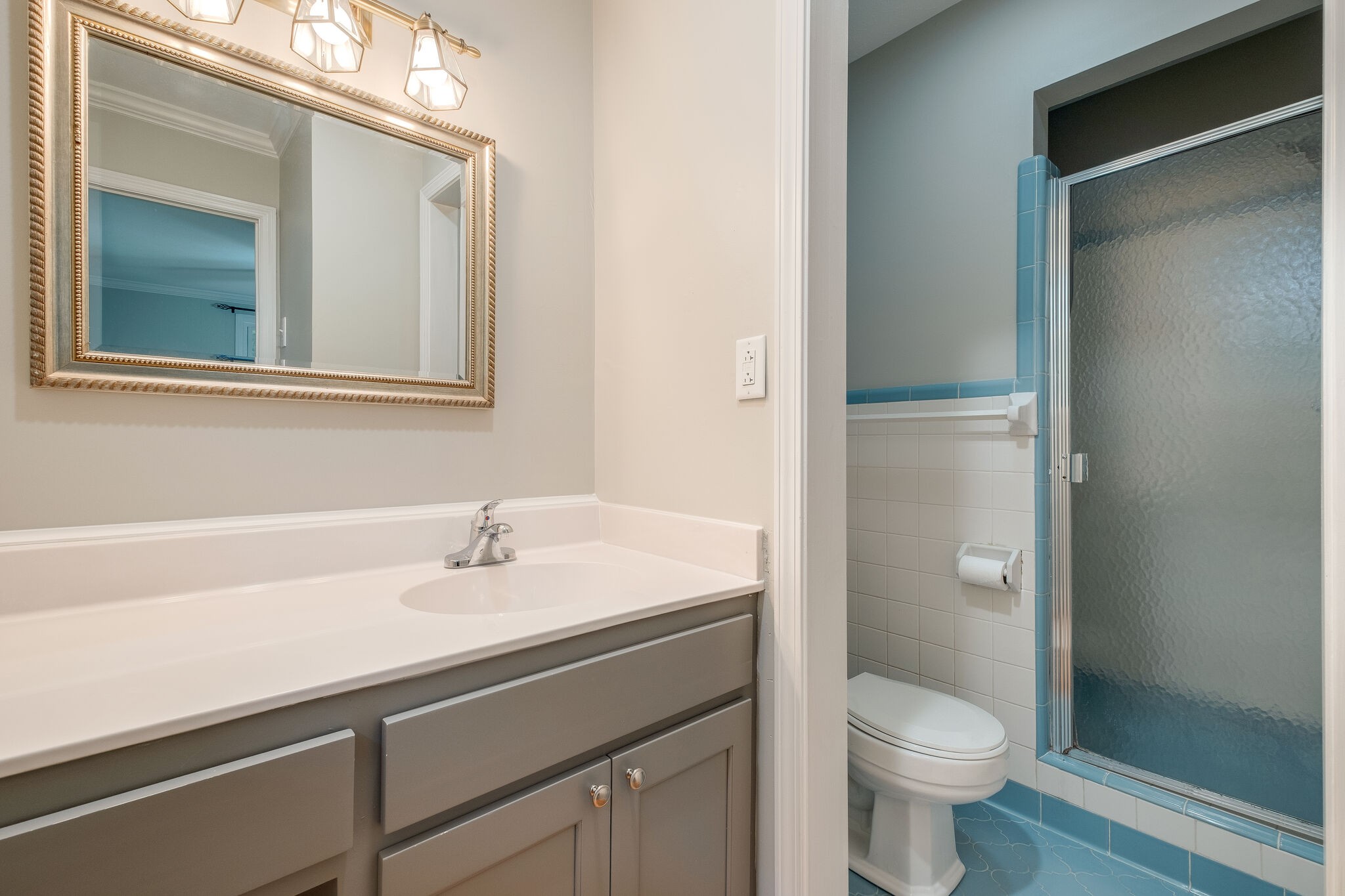 8860 Lyles Road Lyles, TN 37098 - Photo 17 of 36 a bathroom with a sink a toilet and shower