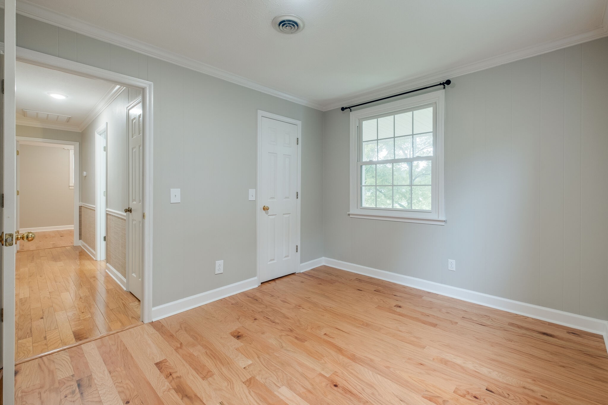 8860 Lyles Road Lyles, TN 37098 - Photo 19 of 36 wooden floor in an empty room with a window