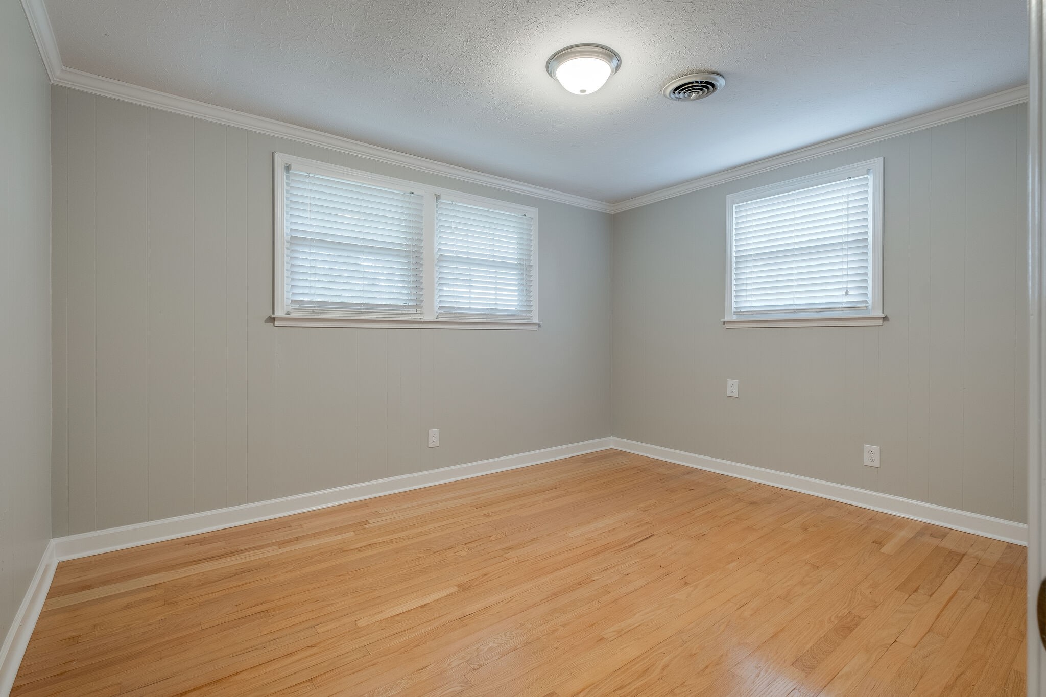 8860 Lyles Road Lyles, TN 37098 - Photo 22 of 36 an empty room with wooden floor and windows