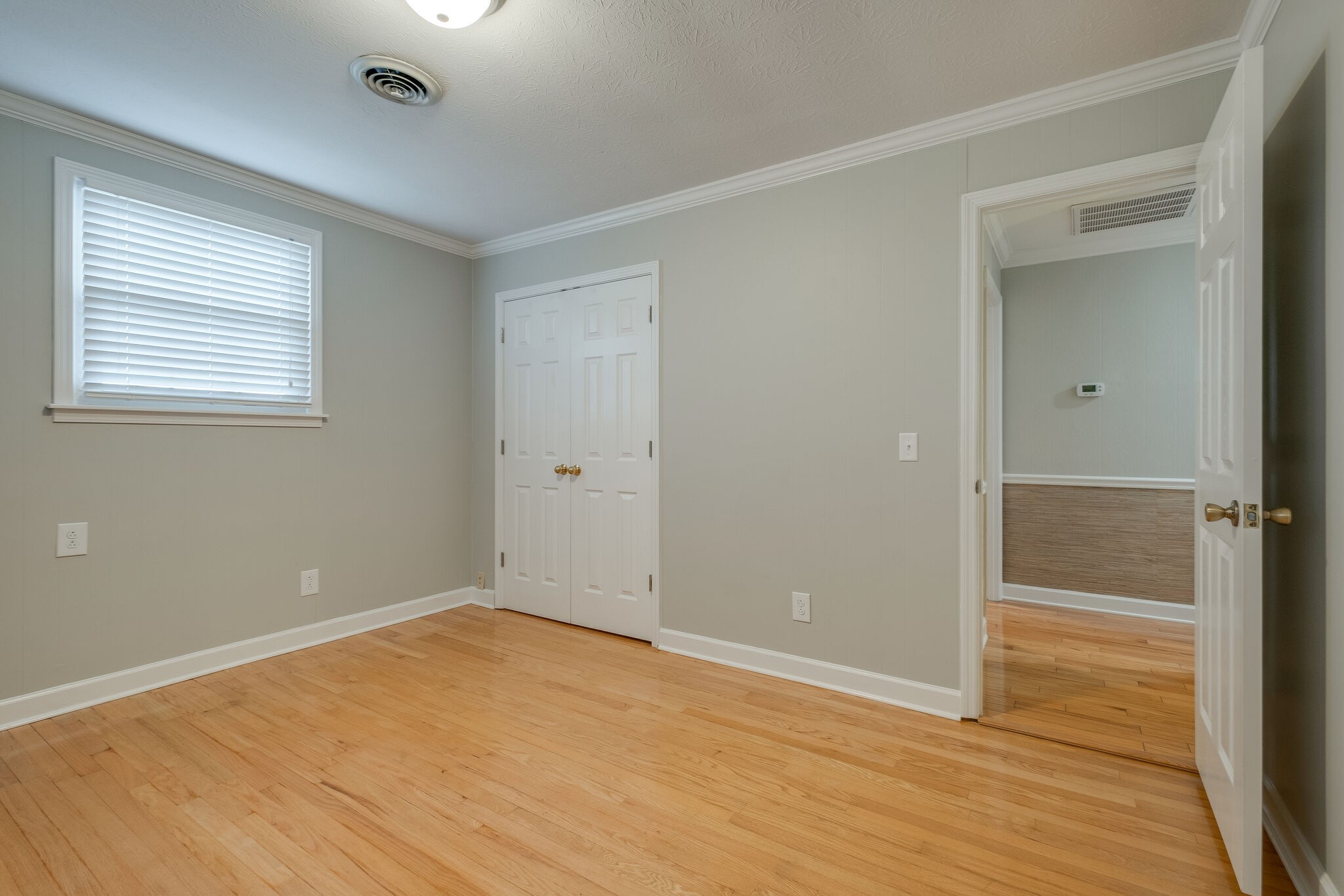 8860 Lyles Road Lyles, TN 37098 - Photo 23 of 36 an empty room with wooden floor and windows