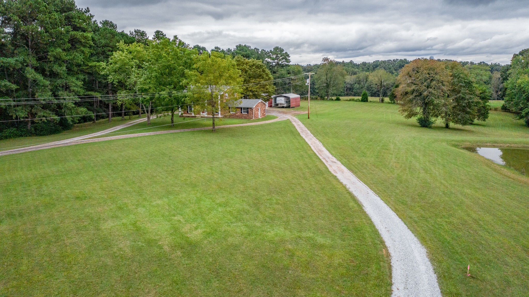 8860 Lyles Road Lyles, TN 37098 - Photo 24 of 36 a view of a big yard with a large trees