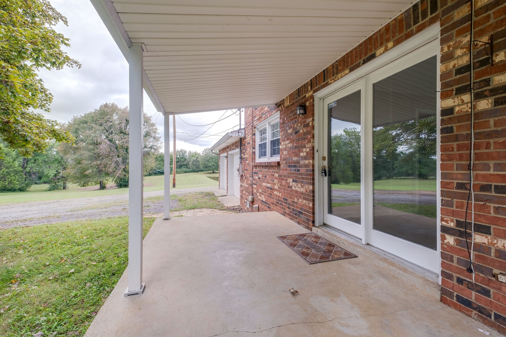 8860 Lyles Road Lyles, TN 37098 - Photo 25 of 36 a backyard of a house with seating space