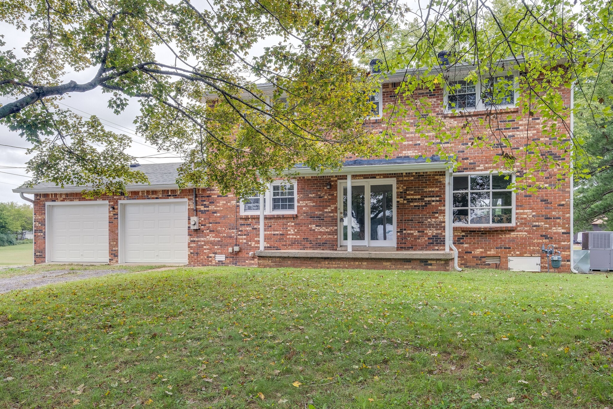 8860 Lyles Road Lyles, TN 37098 - Photo 26 of 36 front view of a house with a yard