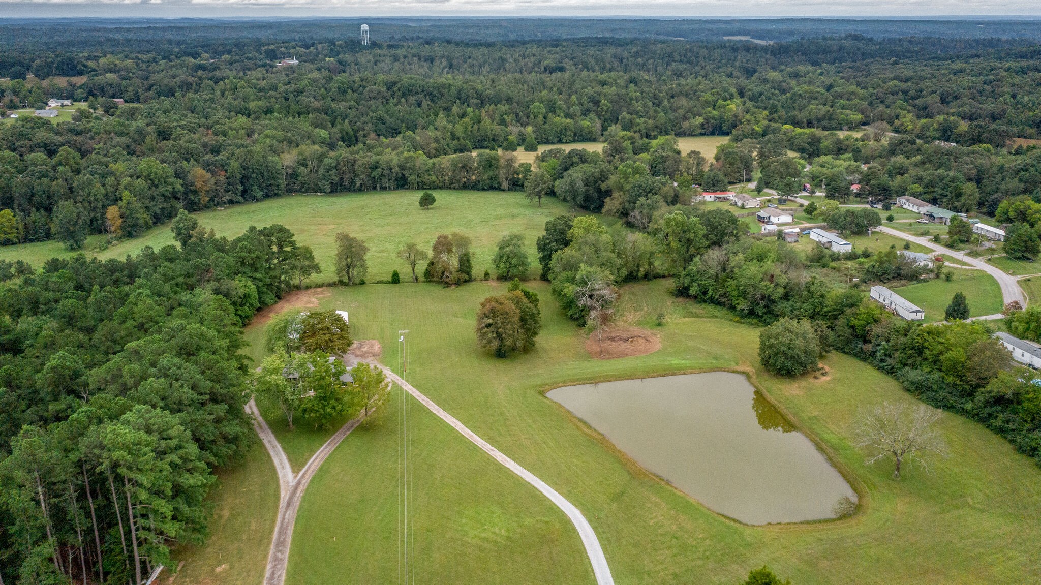 8860 Lyles Road Lyles, TN 37098 - Photo 28 of 36 a view of a swimming pool with a yard