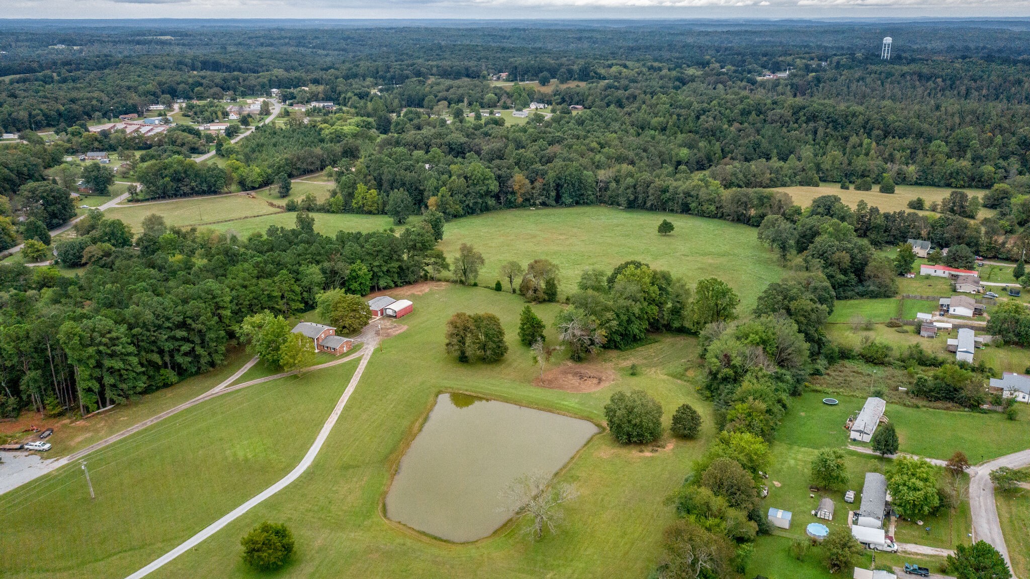 8860 Lyles Road Lyles, TN 37098 - Photo 29 of 36 an aerial view of a residential houses with outdoor space and trees