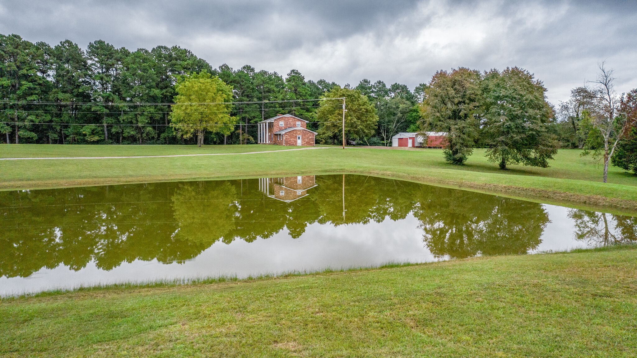 8860 Lyles Road Lyles, TN 37098 - Photo 35 of 36 a view of a swimming pool and a yard