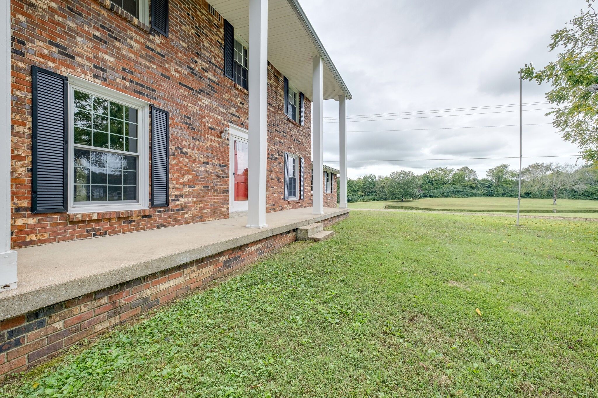 8860 Lyles Road Lyles, TN 37098 - Photo 6 of 36 a view of a house with a yard and sitting area