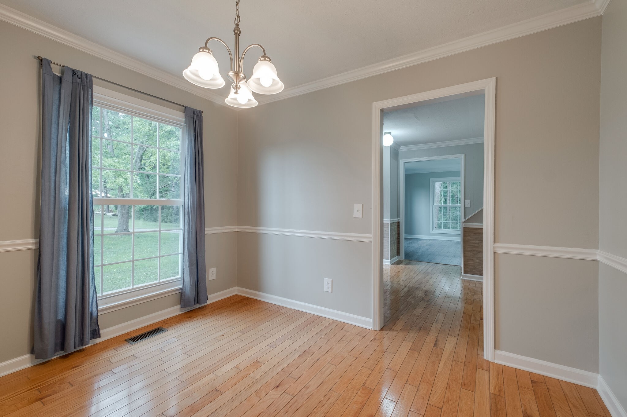8860 Lyles Road Lyles, TN 37098 - Photo 8 of 36 wooden floor in an empty room with a window