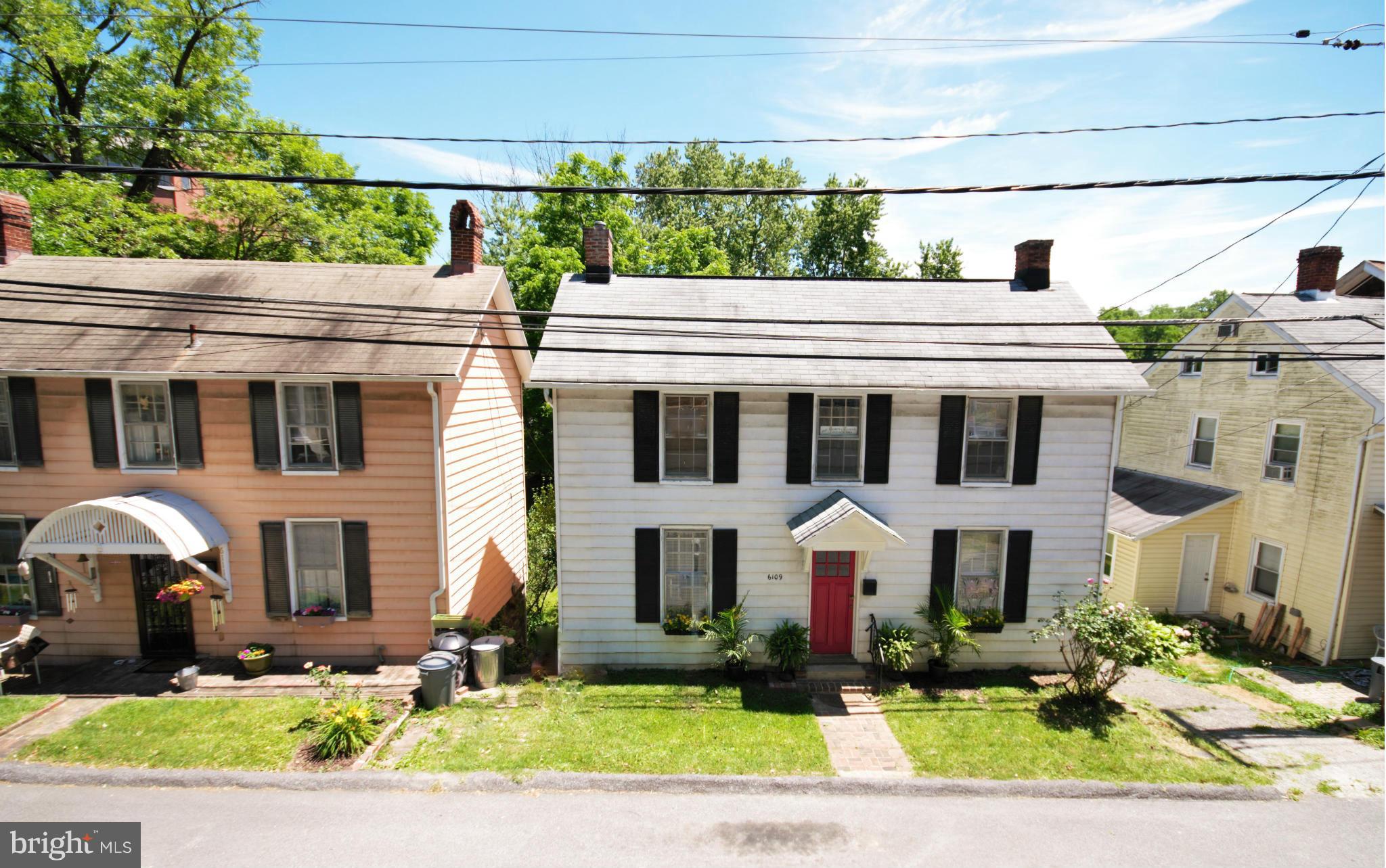 6109 Falls Road Baltimore, MD 21209 - Photo 1 of 26 a front view of a house with garden