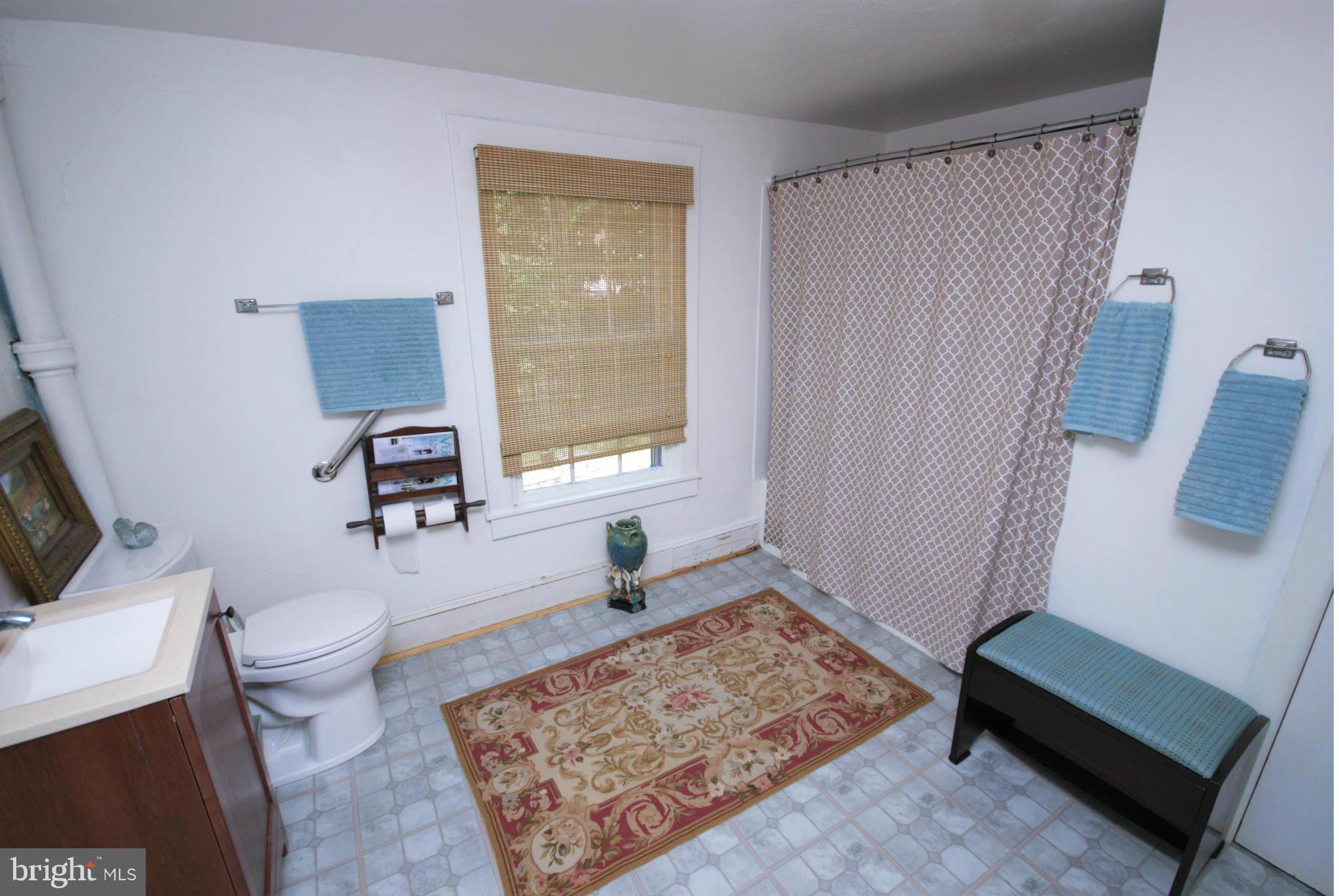 6109 Falls Road Baltimore, MD 21209 - Photo 14 of 26 a living room with furniture and a gate