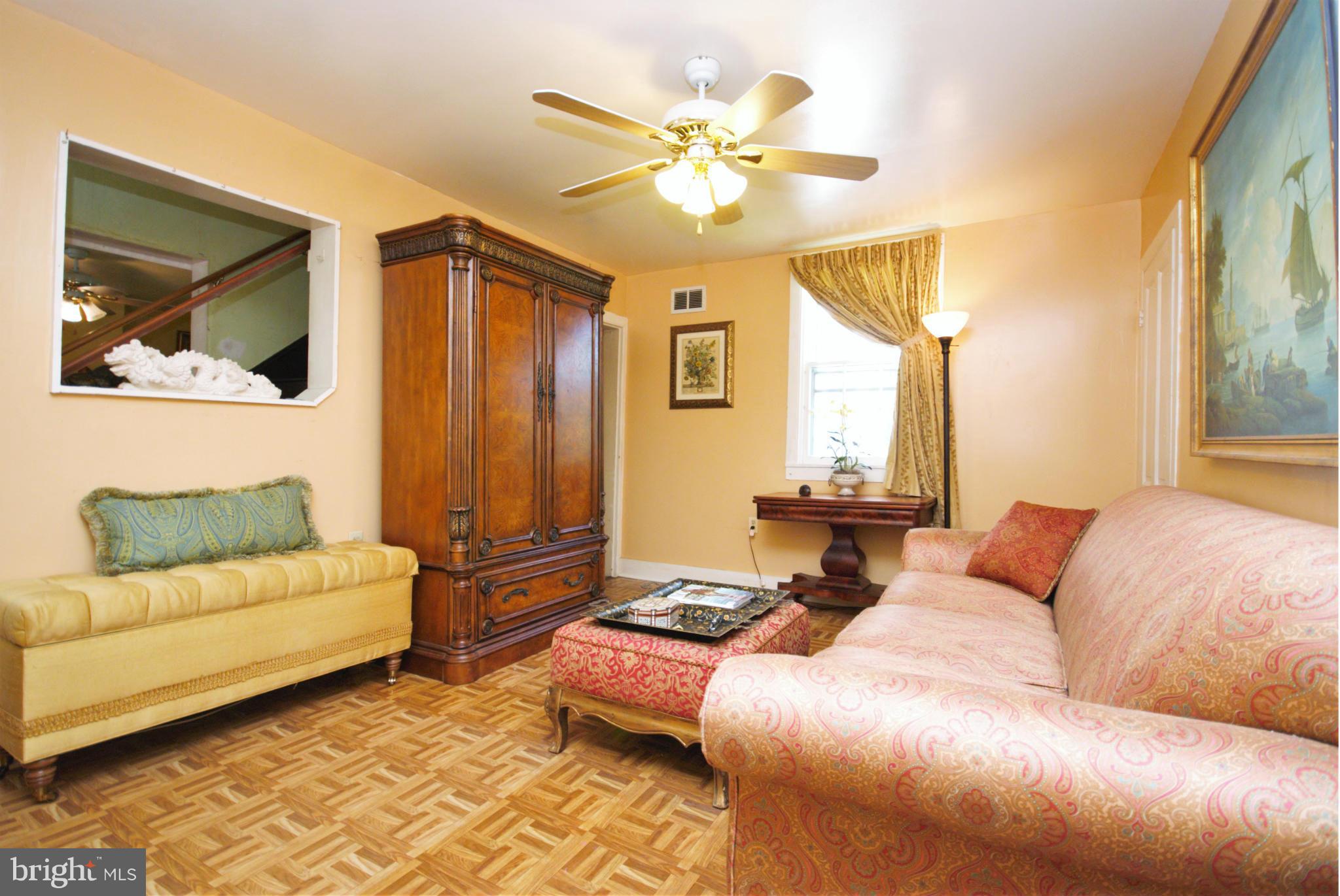 6109 Falls Road Baltimore, MD 21209 - Photo 3 of 26 a living room with furniture and a large window