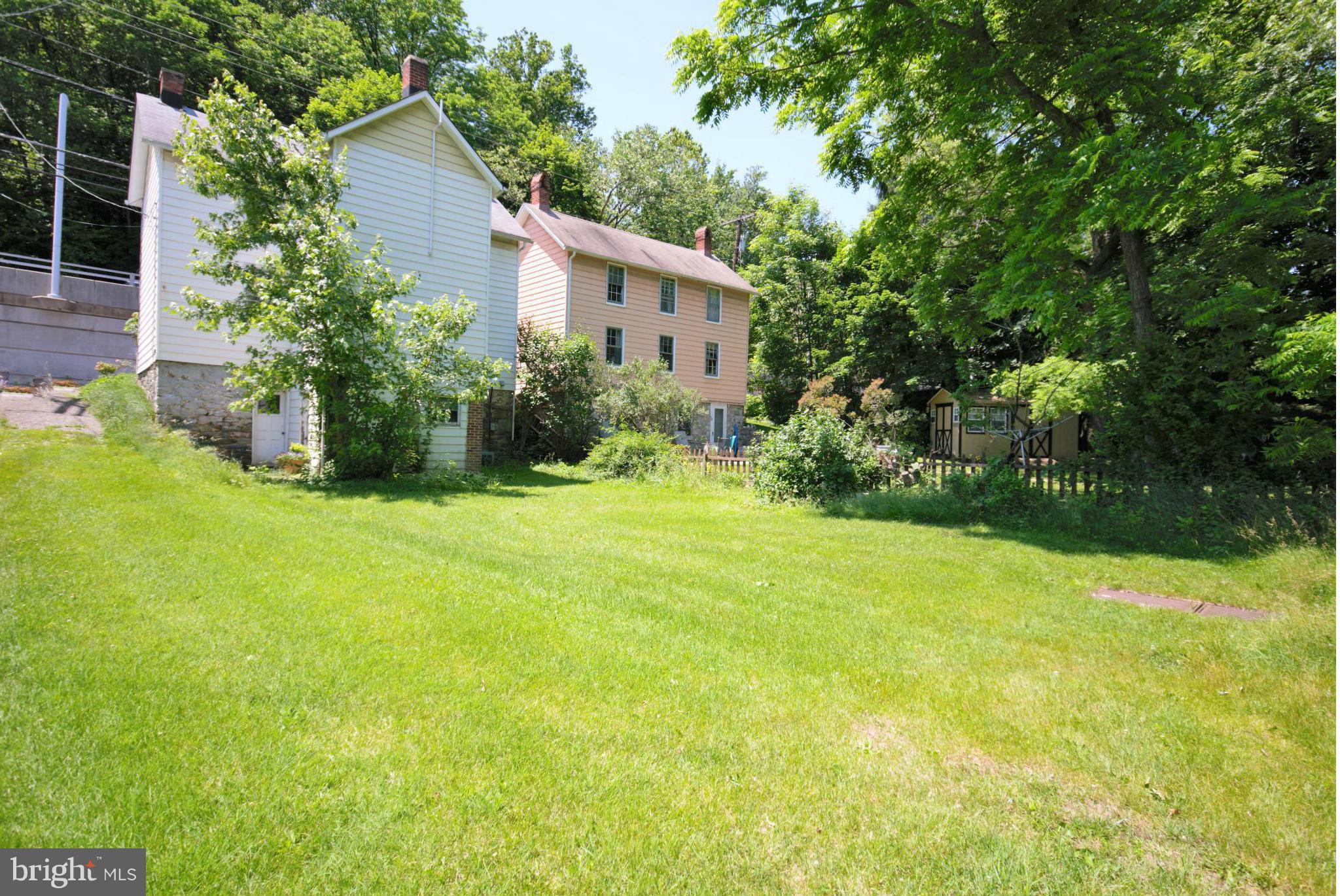 6109 Falls Road Baltimore, MD 21209 - Photo 21 of 26 a view of a house with backyard and garden