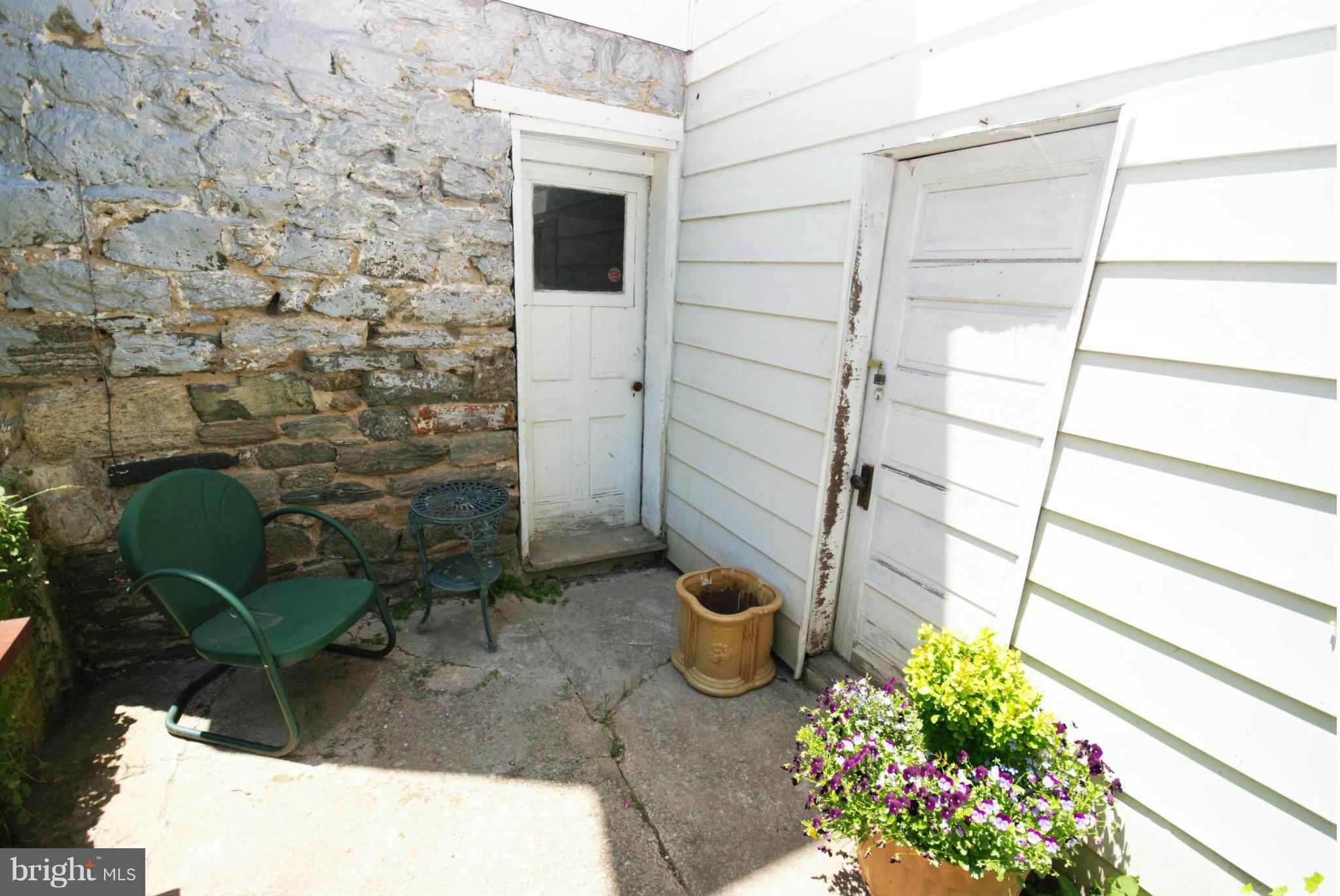 6109 Falls Road Baltimore, MD 21209 - Photo 25 of 26 a view of a balcony with chair and potted plant