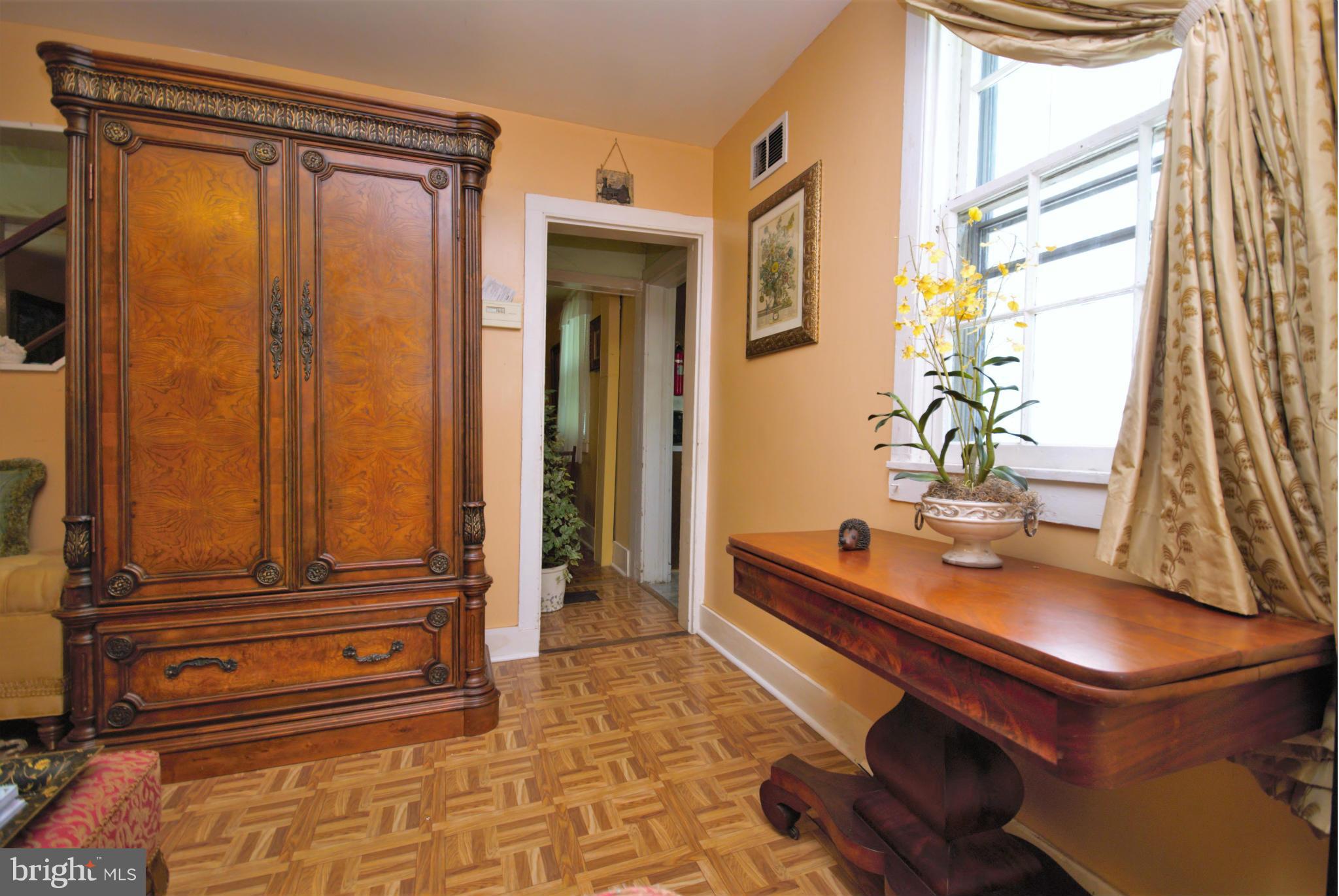 6109 Falls Road Baltimore, MD 21209 - Photo 5 of 26 a living room with furniture and a window