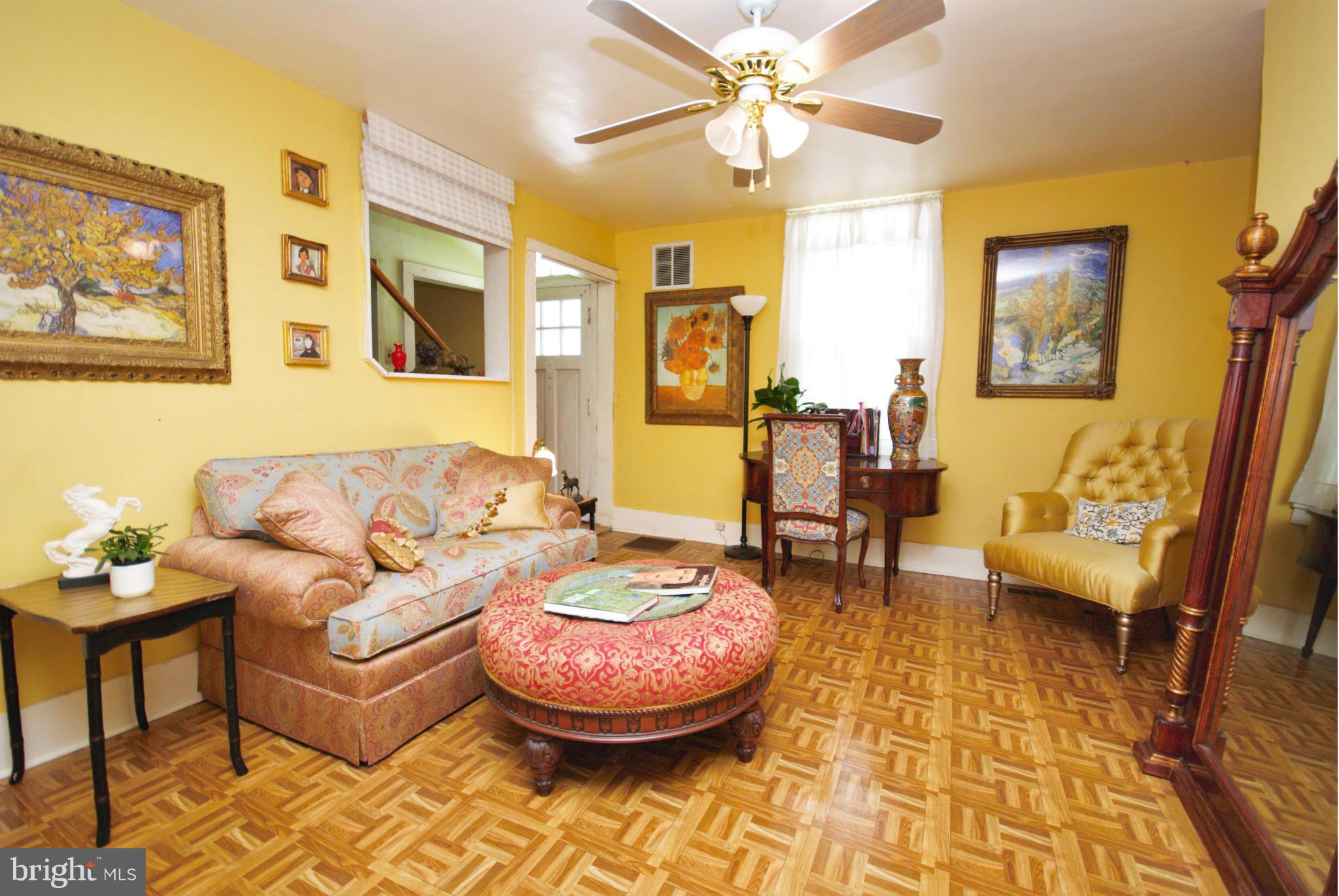 6109 Falls Road Baltimore, MD 21209 - Photo 8 of 26 a living room with furniture and a chandelier
