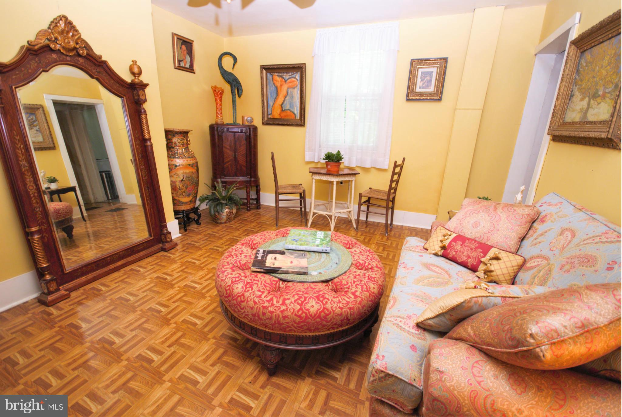 6109 Falls Road Baltimore, MD 21209 - Photo 9 of 26 a living room with furniture and a wooden floor