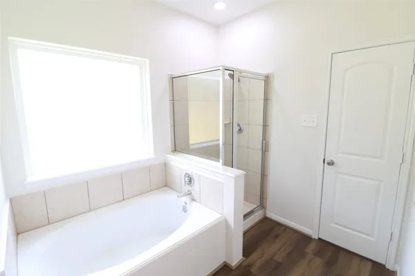 a large white kitchen with kitchen island and a sink