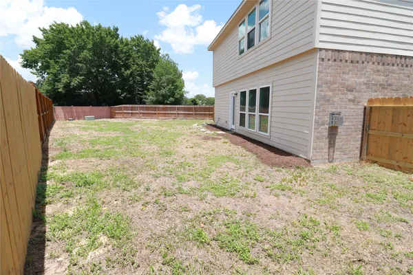 a house with yard in front of it