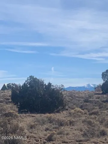 a view of a field of mountains and valleys