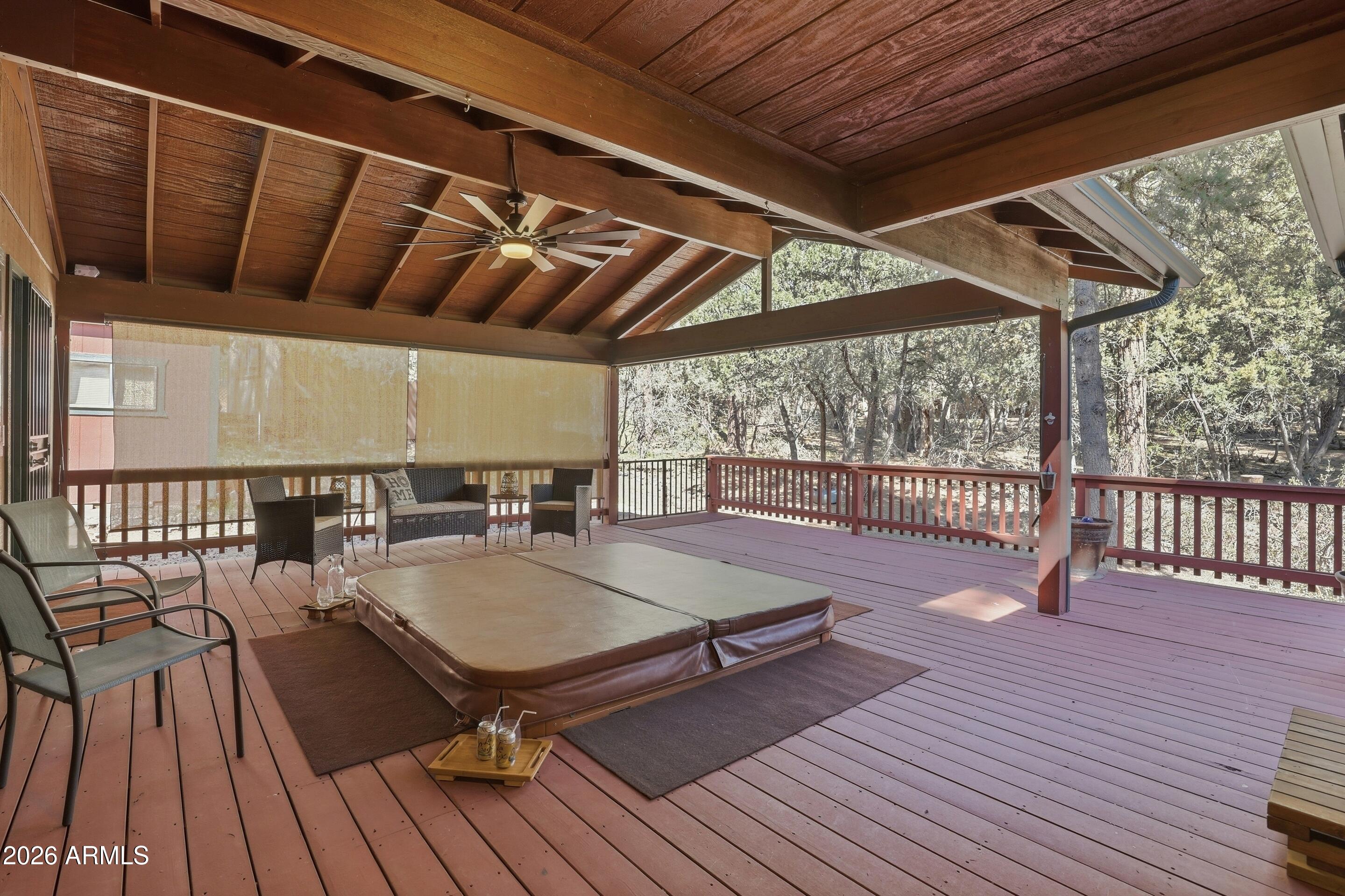 6740 Ridge Road Pine, AZ 85544 - Photo 27 of 35 a view of balcony with wooden floor and outdoor seating