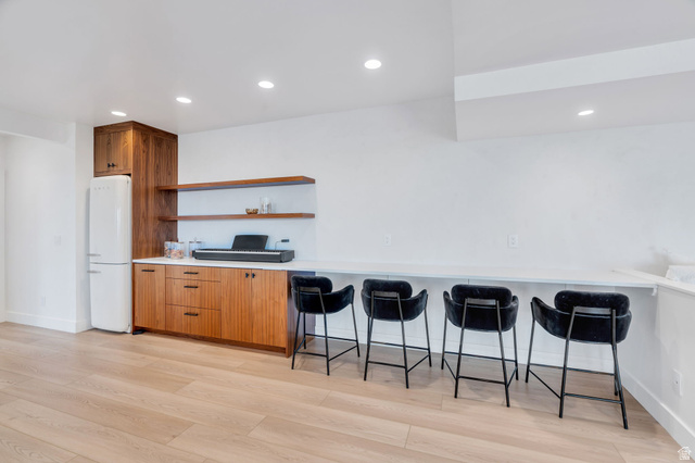 3918 South Mapleton Ests Drive Mapleton, UT 84664 - Photo 66 of 103 Kitchen featuring open shelves, recessed lighting, freestanding refrigerator, light countertops, and light wood-style flooring