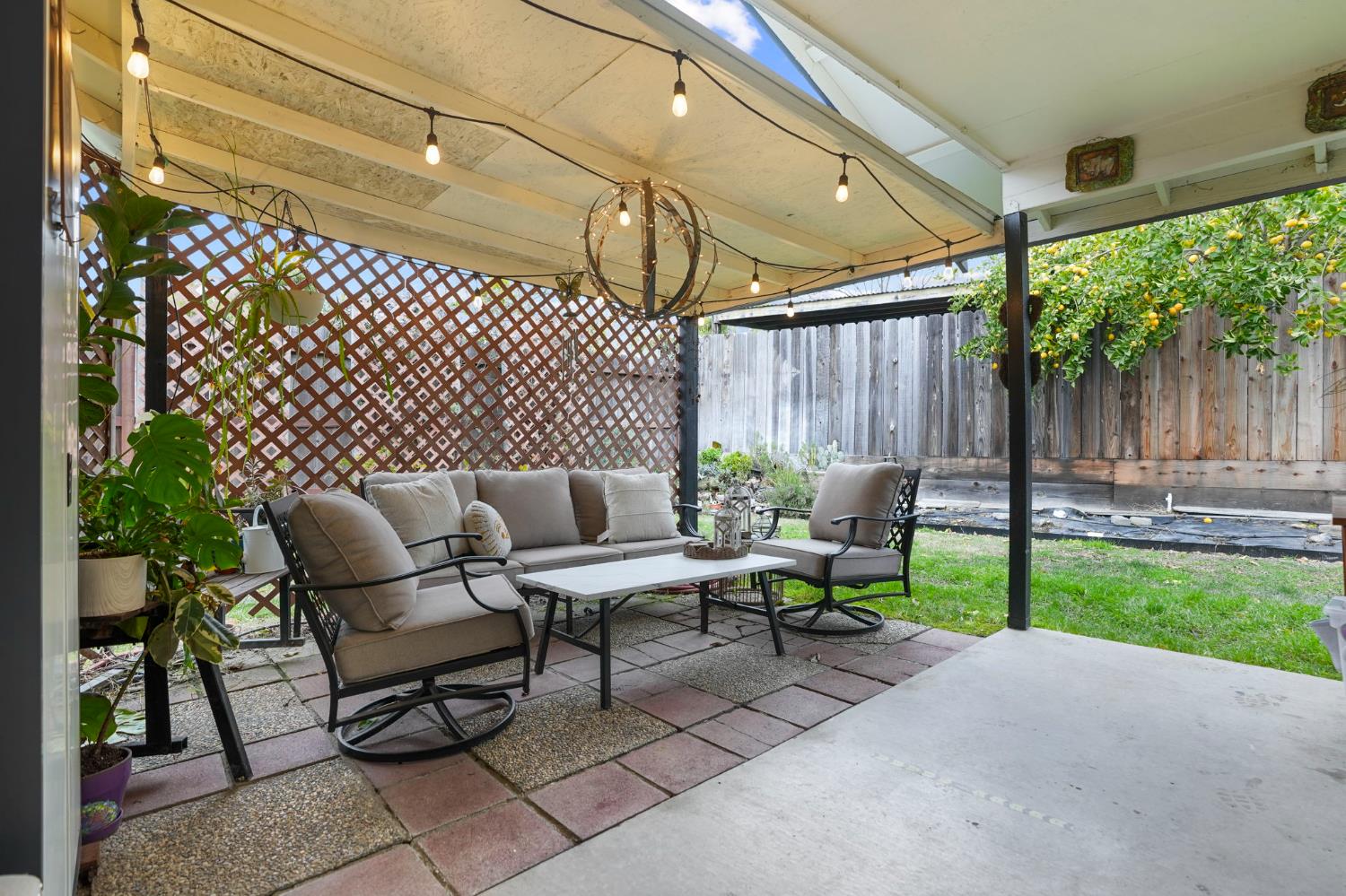 1017 Jayhawk Way Modesto, CA 95358 - Photo 23 of 32 a outdoor living space with furniture and a garden