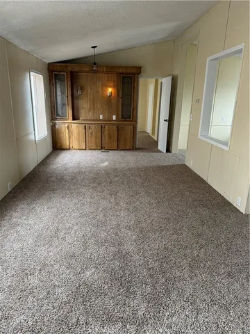 a view of a livingroom with furniture and a fireplace