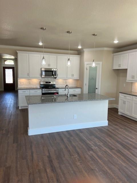3003 Steepleridge Circle Granbury, TX 76048 - Photo 3 of 8 a view of kitchen with cabinets microwave and stove