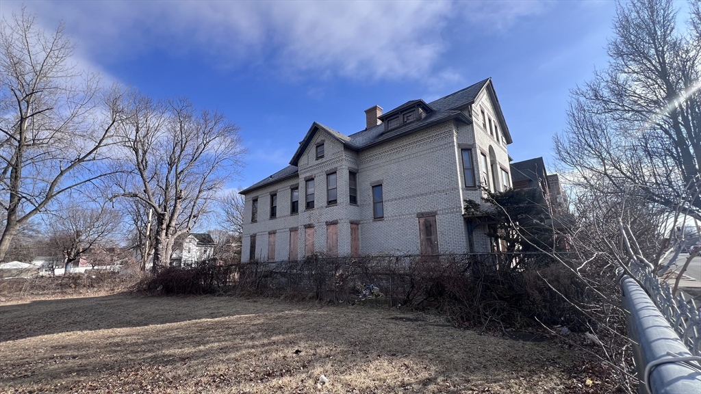 2345 Main Street Springfield, MA 01107 - Photo 2 of 13 a view of a house with a yard