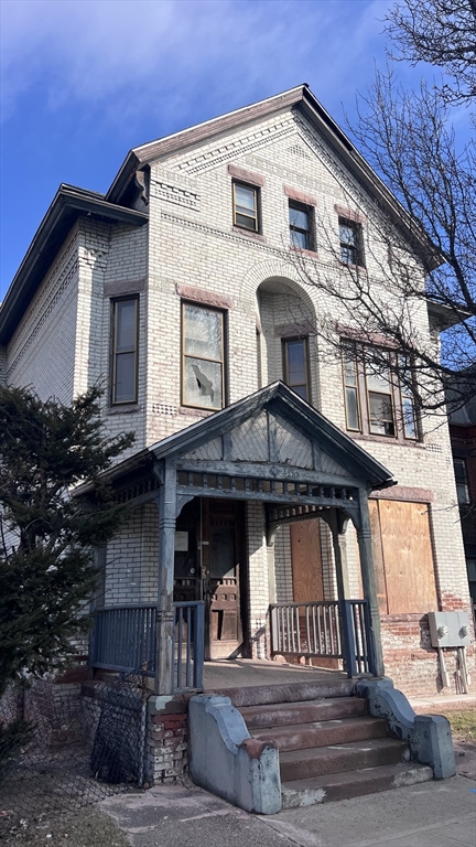 2345 Main Street Springfield, MA 01107 - Photo 4 of 13 a front view of a house with a porch