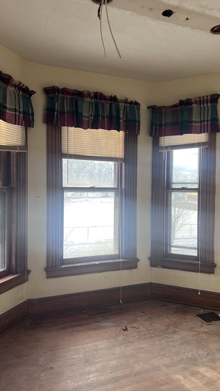 2345 Main Street Springfield, MA 01107 - Photo 8 of 13 an empty room with wooden floor and windows