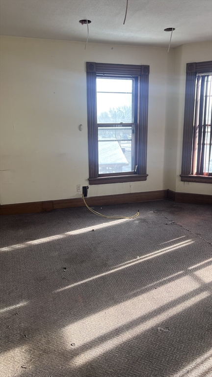 2345 Main Street Springfield, MA 01107 - Photo 9 of 13 an empty room with windows