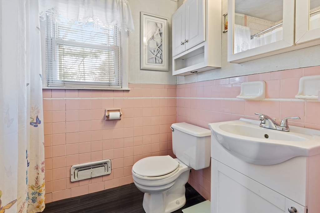 90 Washington Terrace Whitman, MA 02382 - Photo 14 of 18 a bathroom with a sink a toilet and a mirror