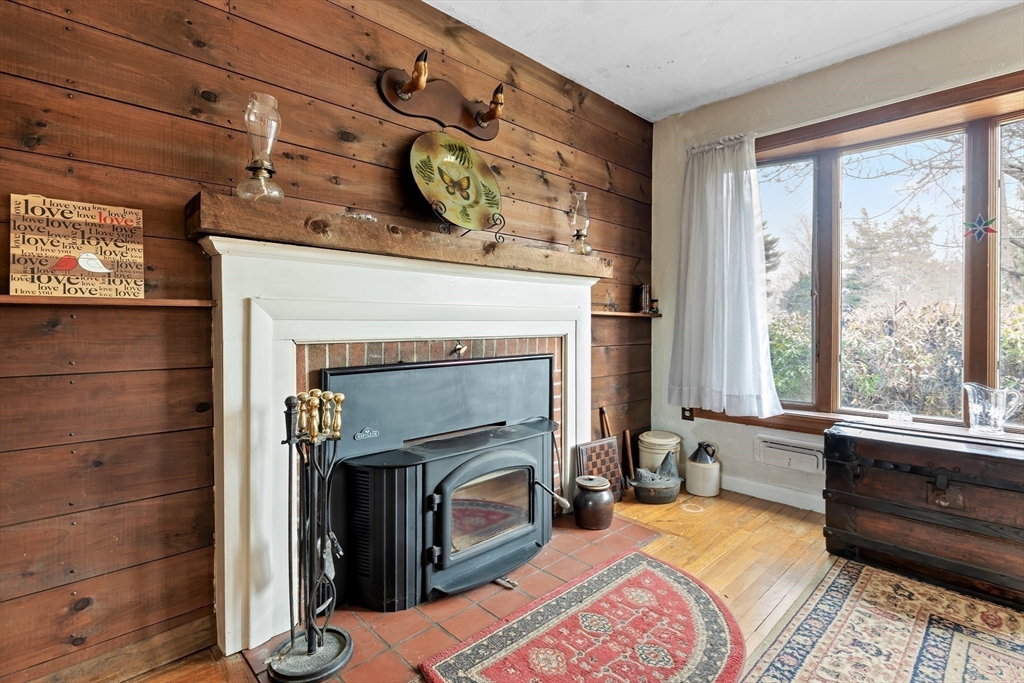 90 Washington Terrace Whitman, MA 02382 - Photo 7 of 18 a bedroom with a bed and a fireplace