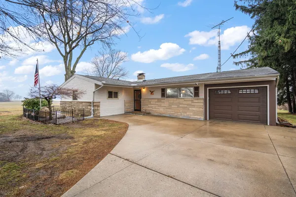 a front view of a house with garage