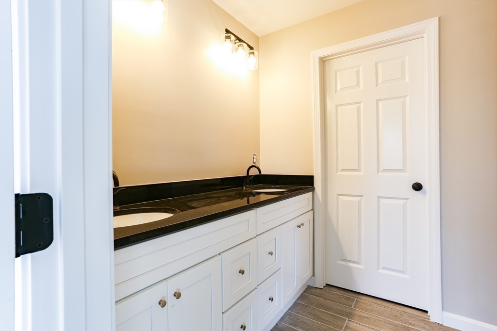 95 Town Farm Road Warren, MA 01083 - Photo 19 of 38 a view of a utility room with wooden floor