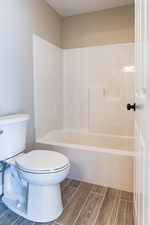 95 Town Farm Road Warren, MA 01083 - Photo 20 of 38 a white toilet sitting next to a bath tub