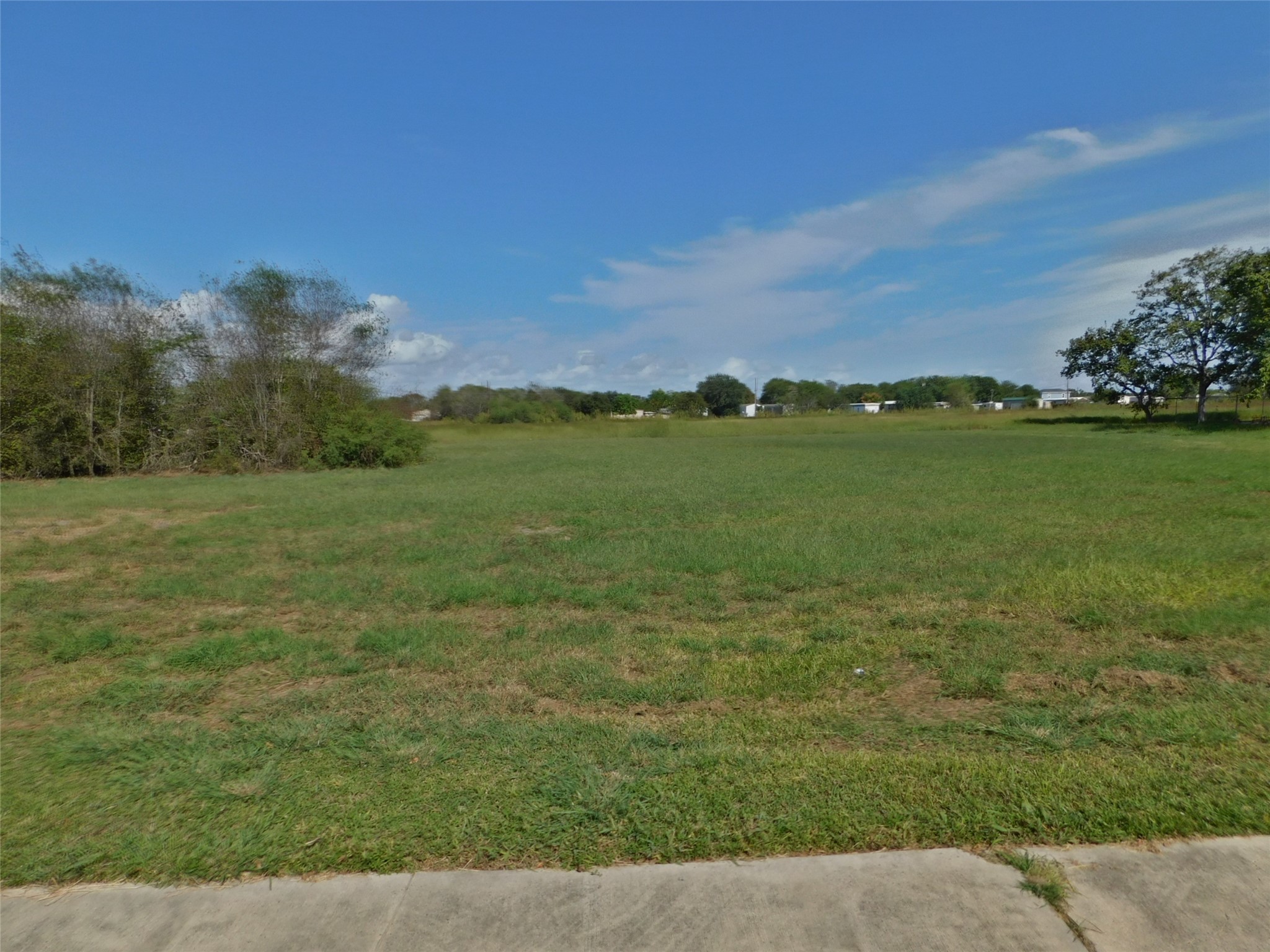 238 Seadrift Street Port Lavaca, TX 77979 - Photo 9 of 11 a view of a field with an trees